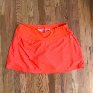 Head tennis skort. Orange. 11 1/2 inches.